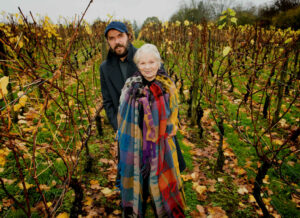 man and woman stood inside a vineyard