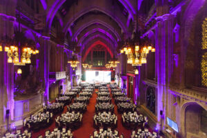 theatre hall filled with dining tables and chairs