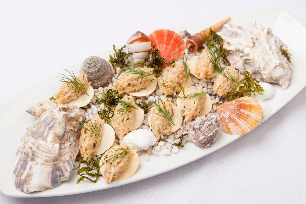 crab and fennel crackers served with served amongst seashells