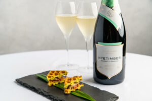 wine bottle and wine glasses with michelin star food