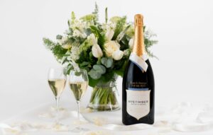 wine bottle, bouquet of flowers