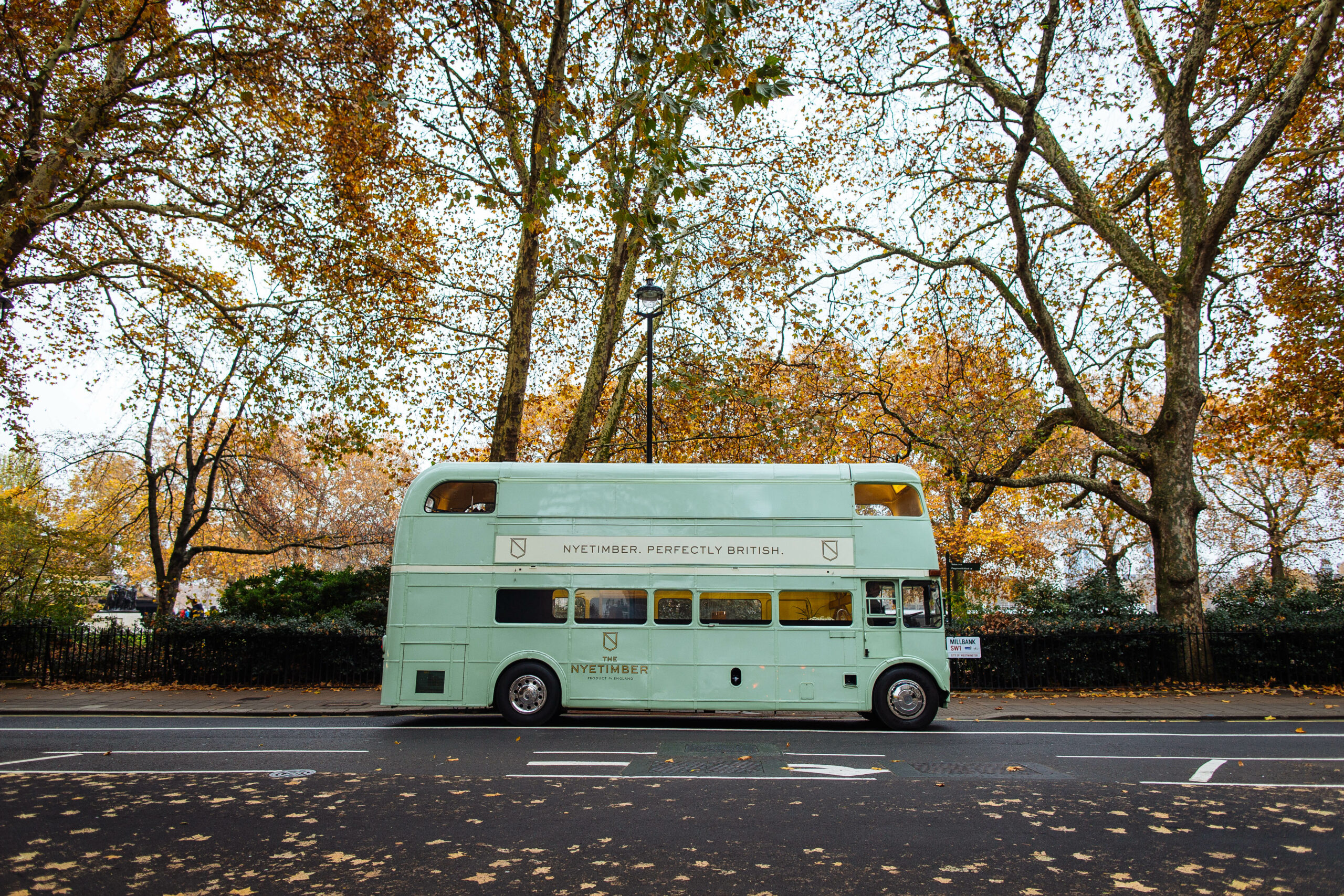 The Nyetimber bus outside on a London street on an autumn day